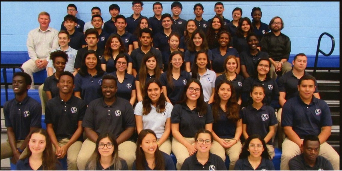 The Senior Class of 2018 in the gym, on the Class Groups page (printed p. 34), with the officers above it.