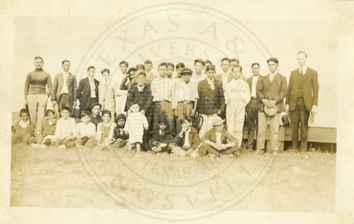 A group of boys with Mr. McLane, photographed by Mrs. Farnham of Paris, Illinois.