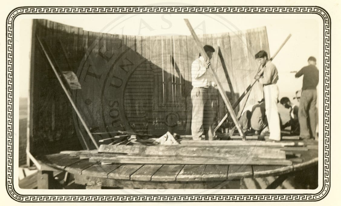 Raising two long timbers.