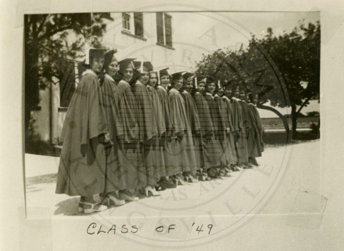 The Class of ’49 in caps and gowns.