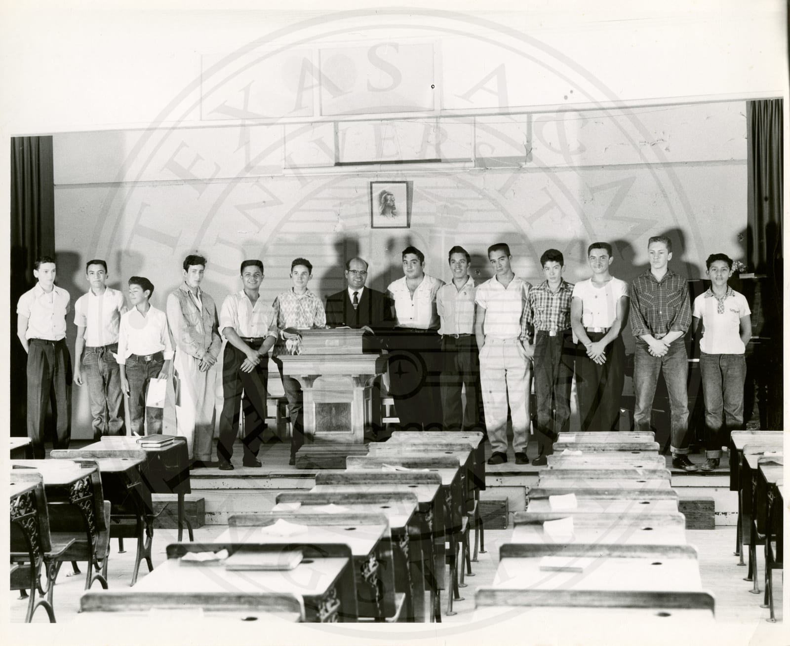 Students in Skinner Hall with an older gentleman, probably their professor.