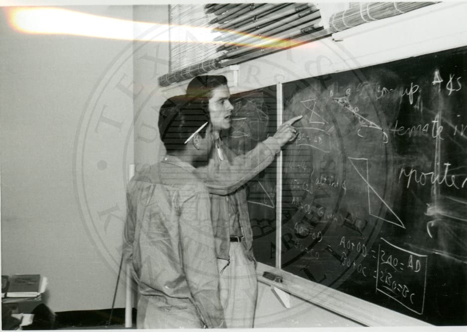 At the blackboard.
