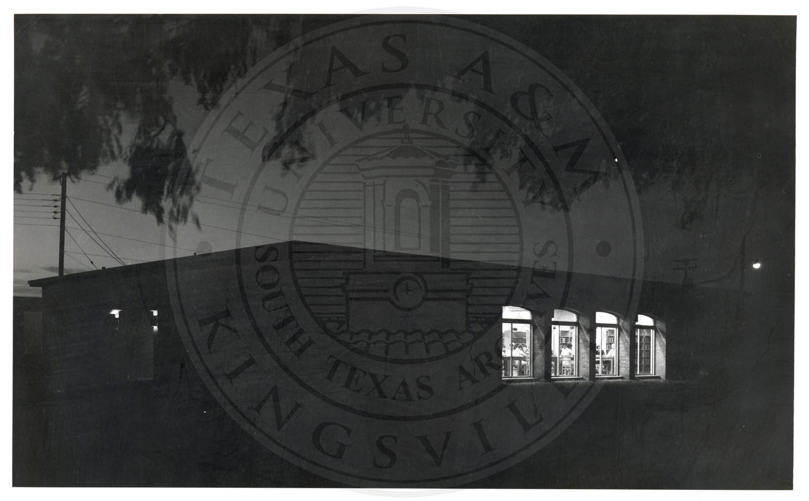 A building at night, students inside, 1965–66.