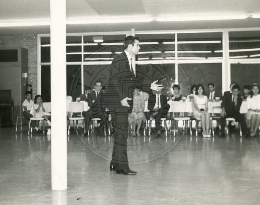 Listening to a speaker in the dining hall, 1966–67.