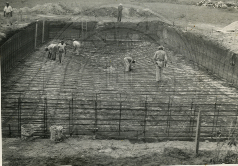 The outdoor swimming pool under construction.