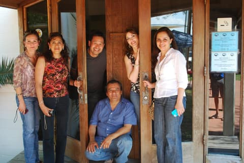 Alumni at the door of the office before the Centennial, 2012.