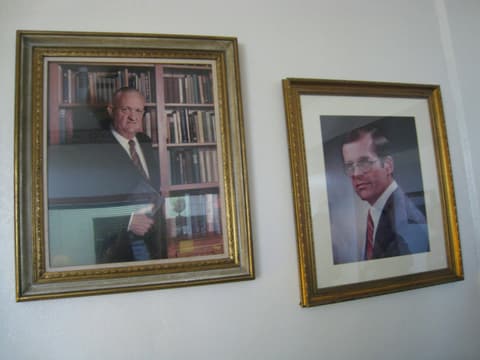 Portraits of past school presidents on the office wall, 2012.