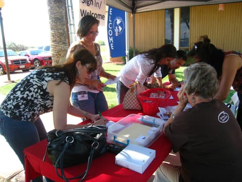 Signing in at the Centennial welcome table, May 2012.