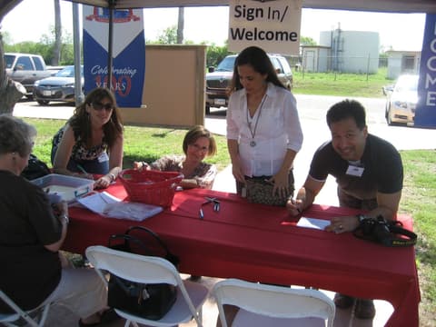 Alumni arriving at the Centennial sign-in table.