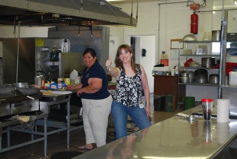 An alumna back in the kitchen where she worked all three of her years at Pan Am.