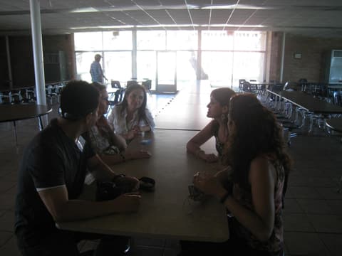 Alumni at a table in the dining hall, 2012.