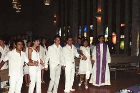 The baptism of Ana Belen Fernandez and Yea Ji Seo in the chapel, with the whole school dressed in white to celebrate with them.