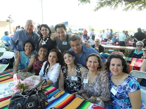 Friends catching up under the tents at the Centennial barbecue, May 2012.