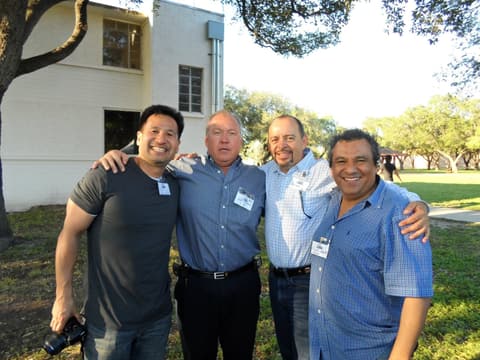 Friends catching up under the tents at the Centennial barbecue, May 2012.