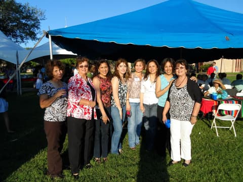 Alumni together at the Centennial barbecue dinner on the lawn, May 2012.