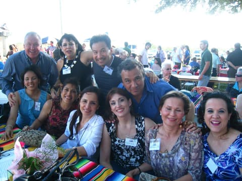 Friends catching up under the tents at the Centennial barbecue, May 2012.