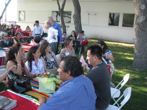 Alumni together at the Centennial barbecue dinner on the lawn, May 2012.