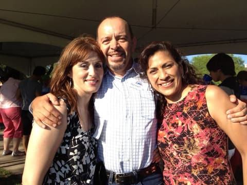 Friends catching up under the tents at the Centennial barbecue, May 2012.