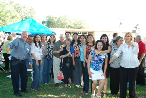 Friends catching up under the tents at the Centennial barbecue, May 2012.