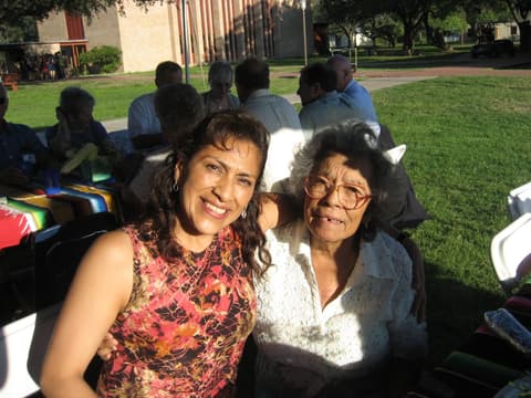 Friends catching up under the tents at the Centennial barbecue, May 2012.