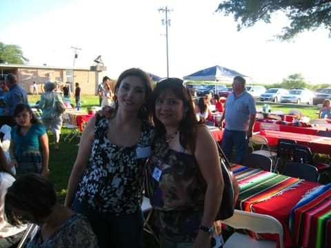 Alumni together at the Centennial barbecue dinner on the lawn, May 2012.