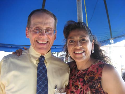 Mr. Gifford, a former teacher, greets an alumna at the Centennial barbecue, May 2012.