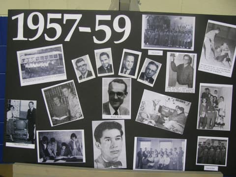 The 1957–59 history board at the Centennial, with portraits of the school’s leaders.