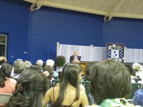 Jimmy Reisner, son of the Reisners and the outgoing head of the school, speaks at the Centennial program.
