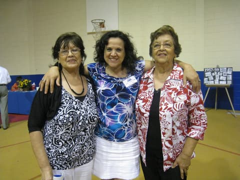 Former staff members Lynda and Oli with an alumna at the Centennial.