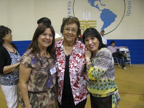 Alumnae with Oli, a longtime staff member, at the Centennial.