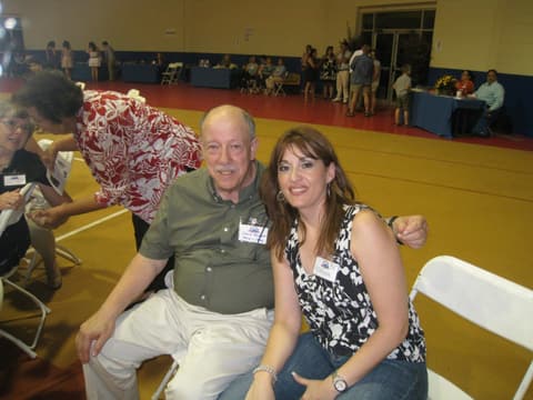 Mr. Hudson with an alumna at the Centennial; students remember him with “respect and affection”.