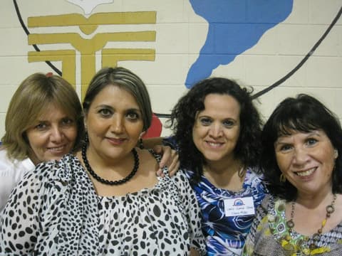 Friends catching up under the tents at the Centennial barbecue, May 2012.