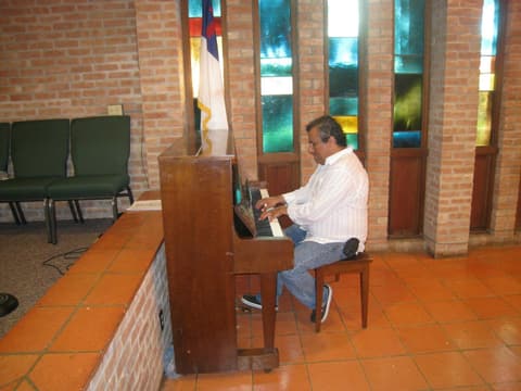 Marcelo Guerrero at the chapel piano during the Centennial visit.