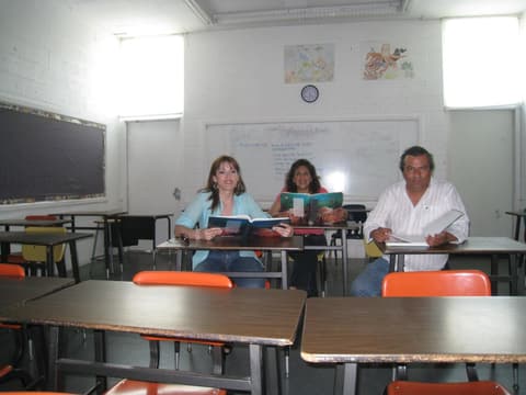 Back at their desks in the biology classroom — no exams this time.