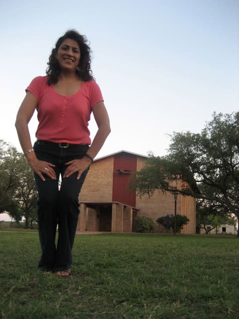 An alumna in front of the chapel, 2012.