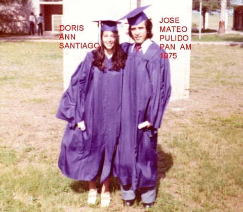 Doris Ann Santiago and Jose Mateo Pulido in their caps and gowns on graduation day.