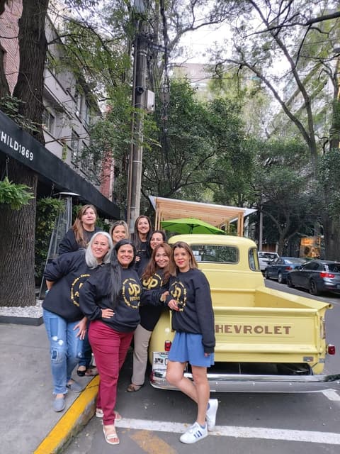 The “JP forever” reunion group by a vintage Chevrolet pickup.