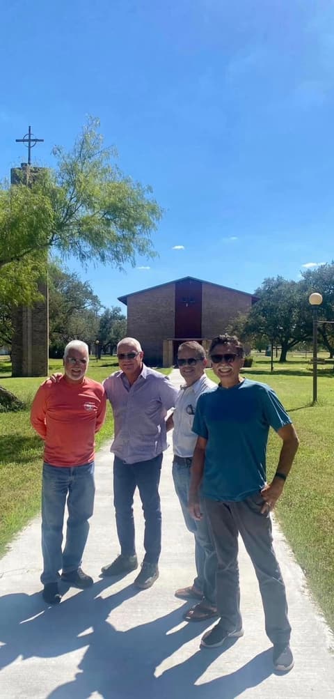 The Cuban classmates of the early 1970s on the walkway to the chapel during their visit.