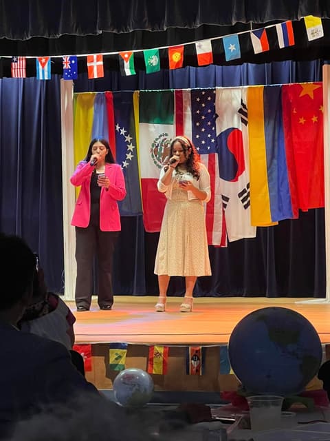 Two students sing “México en la piel” and “Si nos dejan” at the International Banquet.
