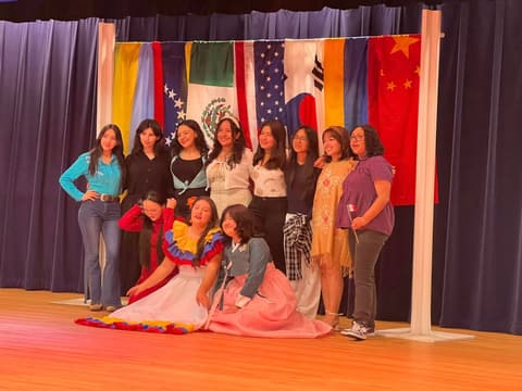 Performers together on stage after the International Banquet show.