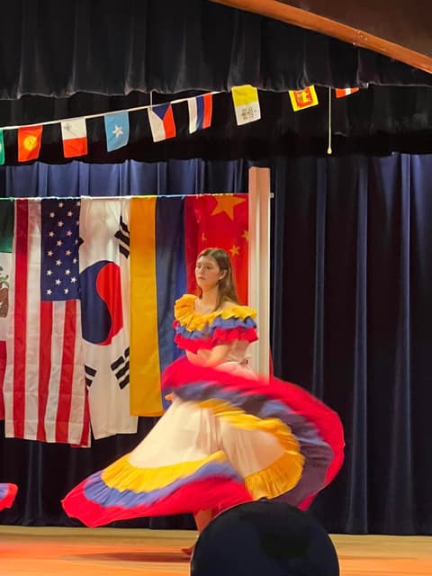 A Colombian dancer swirls her skirt at the International Banquet.