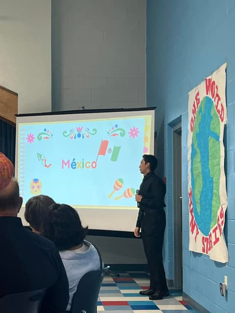 A student presents on México at the “One World, Many Stories” International Banquet, March 2024.