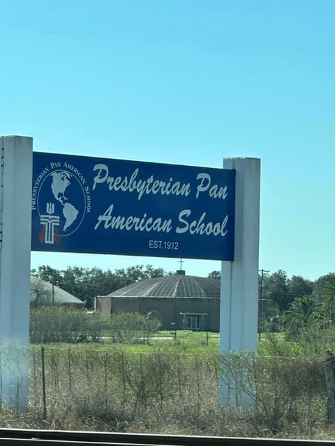 The Presbyterian Pan American School sign on the road into campus, “Est. 1912”.