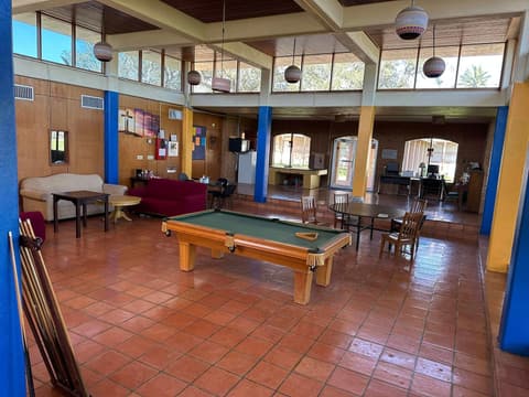 The student center lounge with its pool table and clerestory windows.