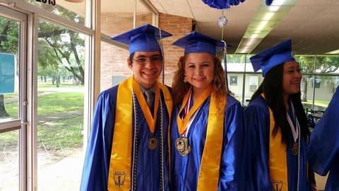 Three honor graduates in the dining hall.