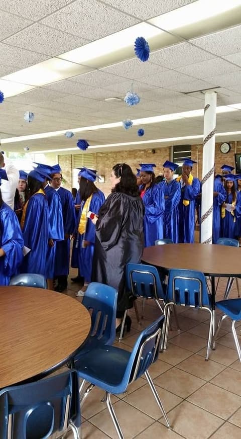 Graduates gathering in the decorated dining hall before the ceremony.
