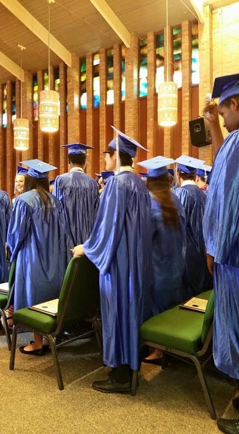 Graduates taking their seats in the chapel.
