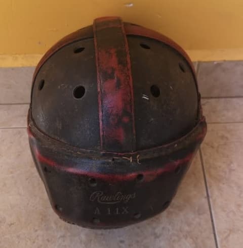 The Tex-Mex-era leather football helmet, with its Rawlings stamp.