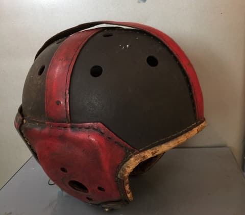 The Tex-Mex-era leather football helmet, side view.
