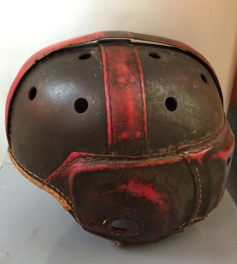 A leather Rawlings football helmet kept from the Tex-Mex football days of the 1950s.